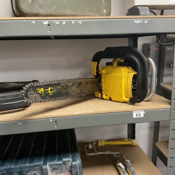 Vintage McCulloch petrol chainsaw in used condition.