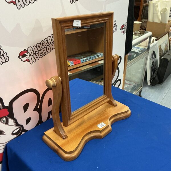 Vintage pine bedroom mirror with wooden frame.