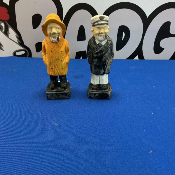 Vintage pair of pipe smoking gentleman figurines, collectible decor.