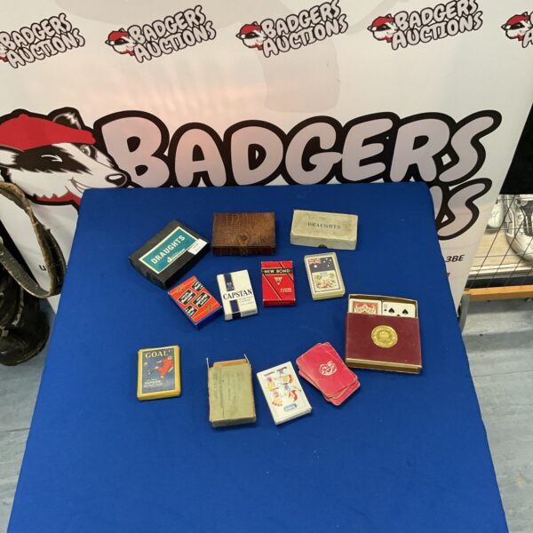 Vintage playing cards and draughts set, antique games collection.