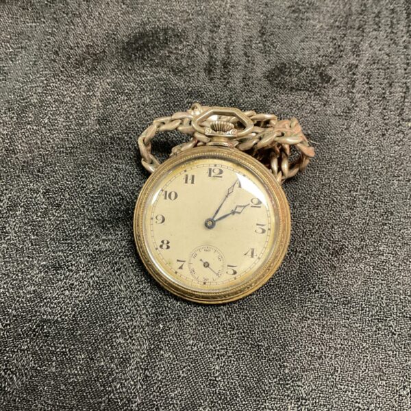 Vintage silver pocket watch with reverse scale dial and chain.