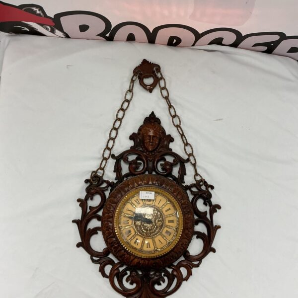 Ornate vintage quartz wall clock for home decor.