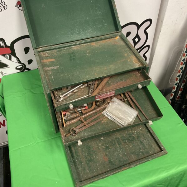 Green vintage Radak metal toolbox with tools visible.