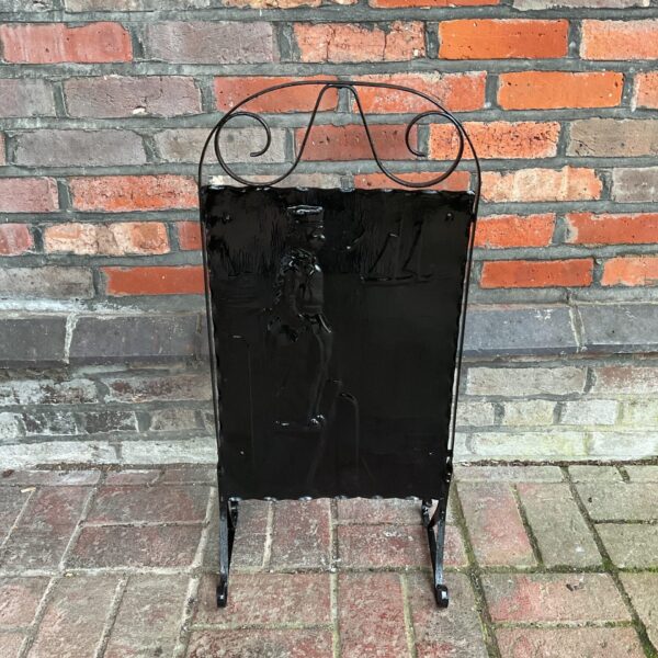 Vintage sailor fire guard with nautical ship design.