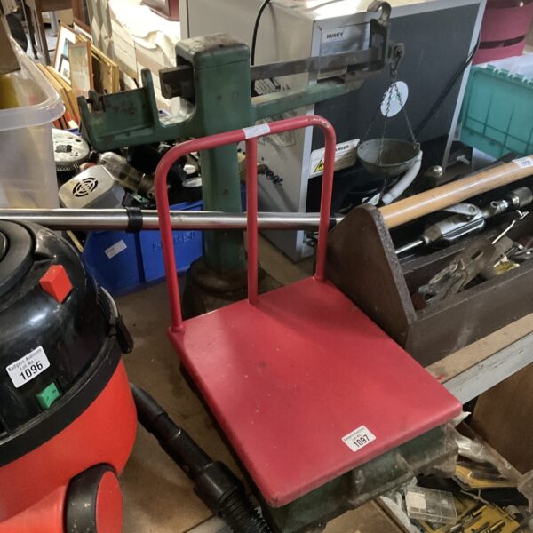 Red vintage Salter platform weighing scales with metal frame.