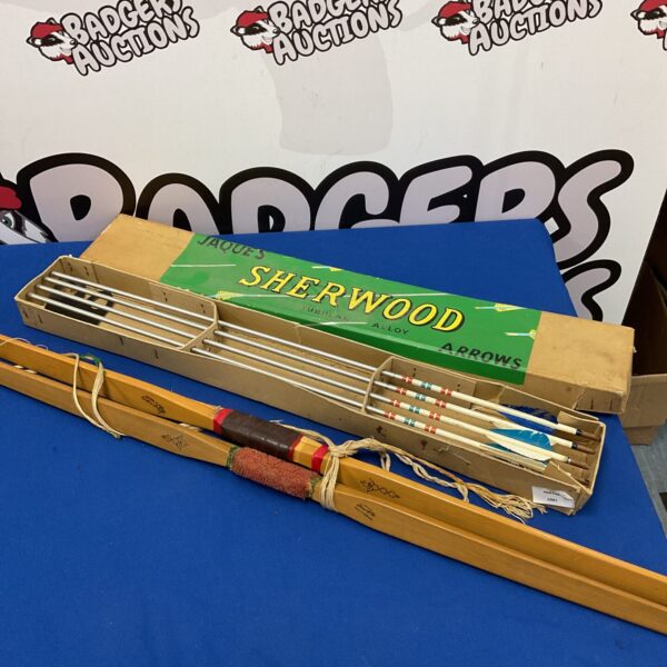 Vintage Slazenger longbows and arrows set for collectors.