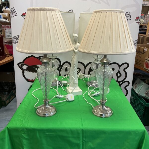 Lot of four vintage clear glass table lamps with shades.