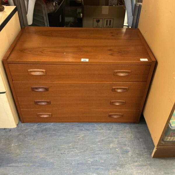 Front view of vintage teak chest of drawers.