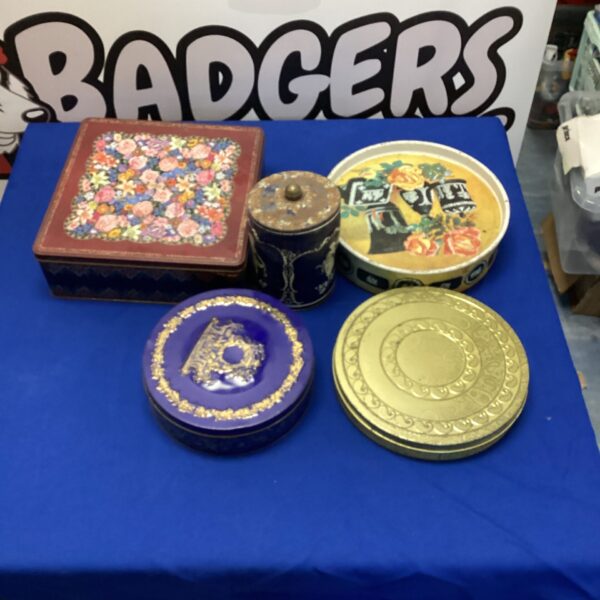 Colourful vintage tin bundle for collectors and storage.
