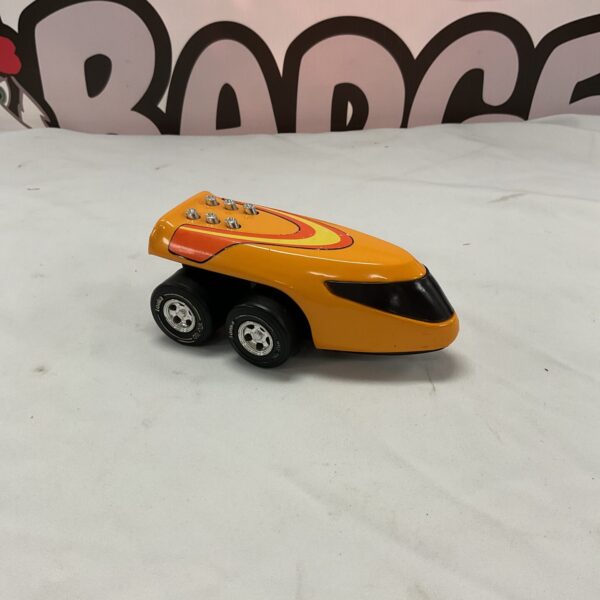 Vintage Tonka metal toy car with orange paint and racing stripes.
