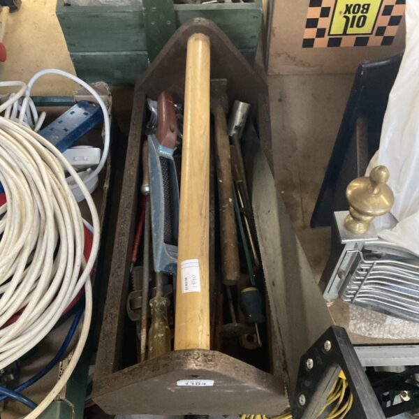 Vintage wooden tool carry box filled with tools.