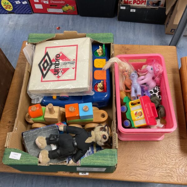 Vintage toy lot featuring My Little Pony and Monopoly board game.