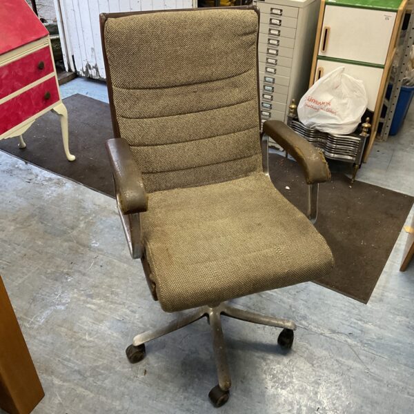 Side view of a vintage Verco office chair with textured upholstery.