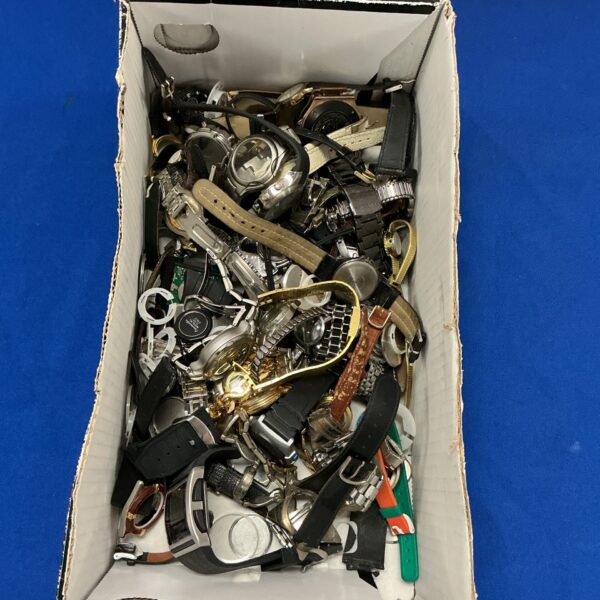 Vintage watch lot with multiple wristwatches in varying conditions.