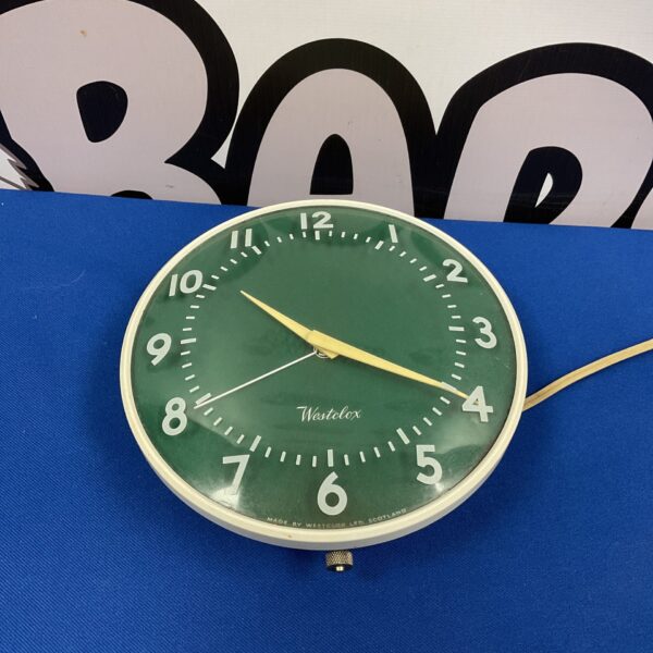Vintage Westclox wall clock with bold numerals and mid-century design.
