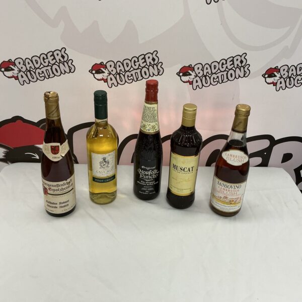 Vintage wine and punch bottles in a collectible lot.