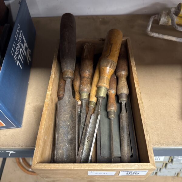 Vintage wood chisels in a lot, ideal for woodworking and collecting.