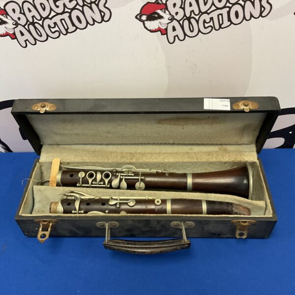 Vintage wooden clarinet in its original case, antique musical instrument.