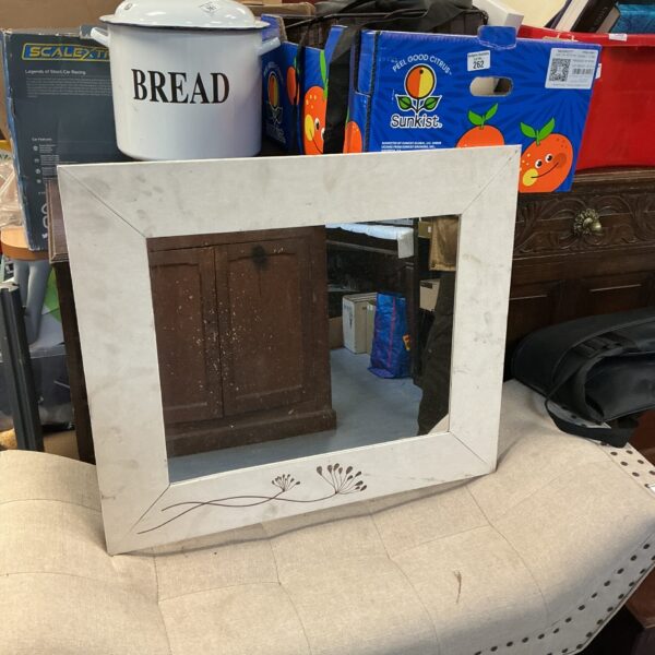 Vintage wooden framed mirror with a warm, natural wood tone.