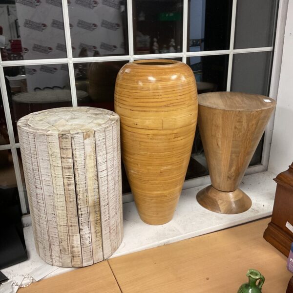 Vintage wooden jardinier stand for displaying plants.