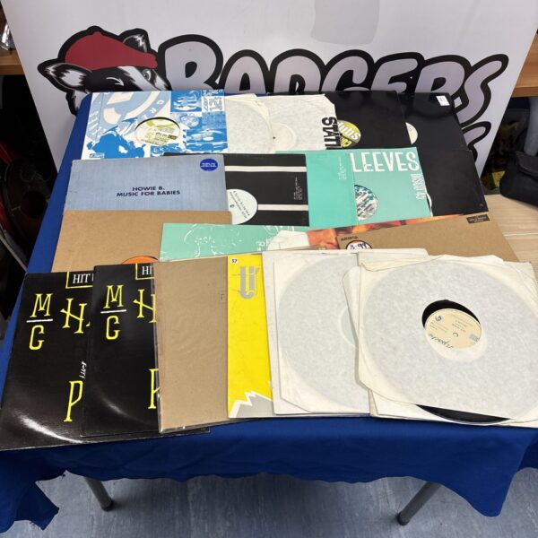 Mixed vinyl record bundle featuring MC Hammer record.