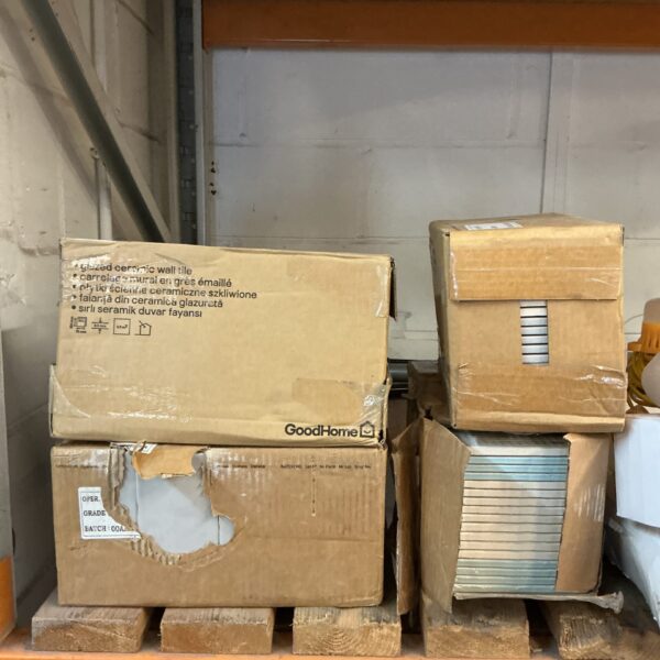 Stack of four boxes containing ceramic wall tiles.