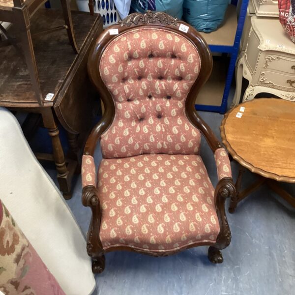 Antique Wardian balloon back armchair with a paisley pattern.