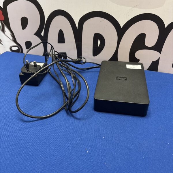 Western Digital external hard drive with USB cable for data storage.