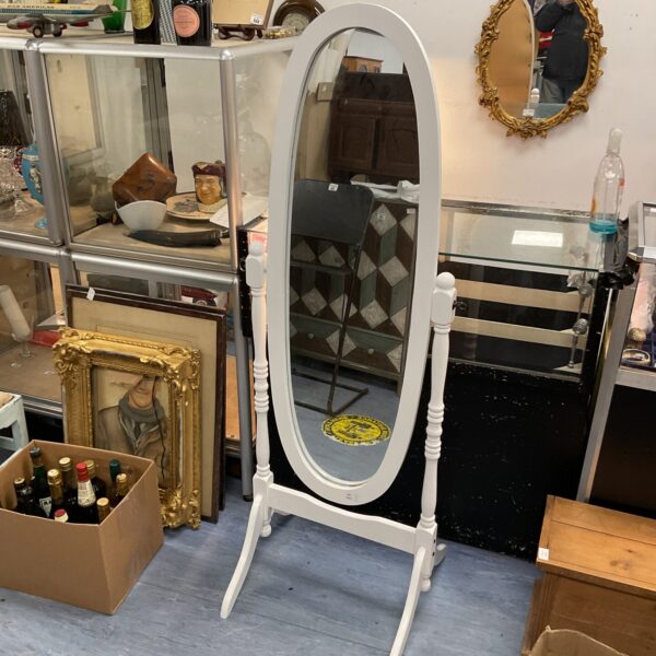 Vintage white oval dressing mirror with wooden frame.