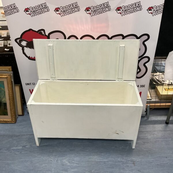 White painted wooden blanket chest for storage and farmhouse decor.
