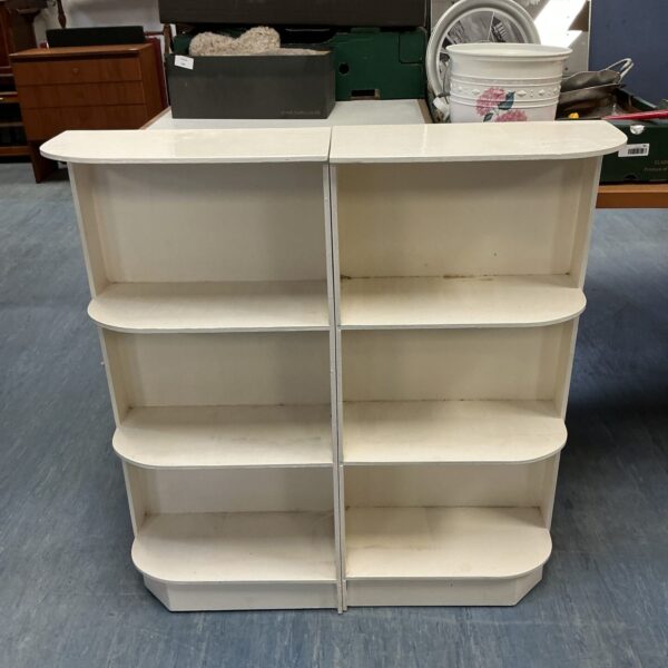 White retro bookshelves with a mid-century modern style.