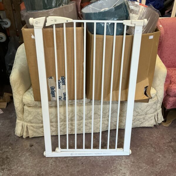 White metal stair gate for child and pet safety.