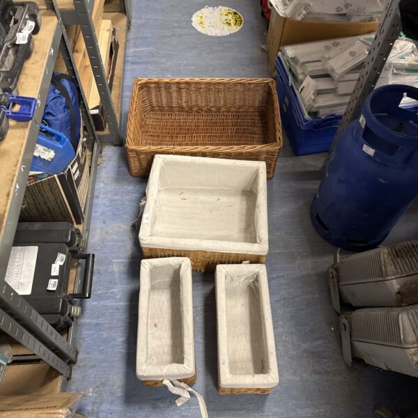Assortment of four rustic wicker baskets for storage and decor.