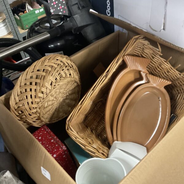 Mixed lot of vintage wicker baskets for storage and decor.