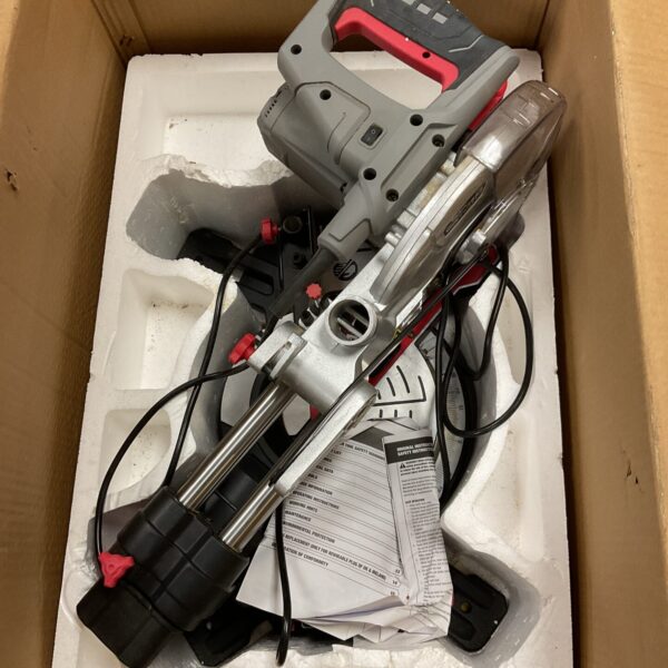 Wickes 210mm sliding mitre saw inside its original cardboard box.