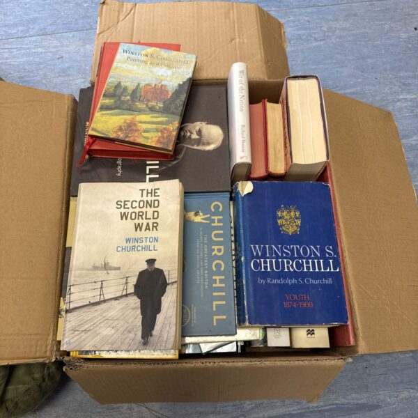 Large collection of vintage Winston Churchill books on a shelf.