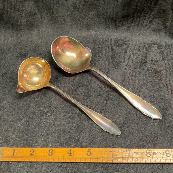 Vintage WMF silver plate serving spoons displayed with ruler.