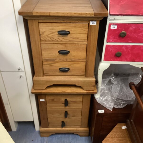 Vintage wooden bedside cabinet with three drawers for bedroom storage.