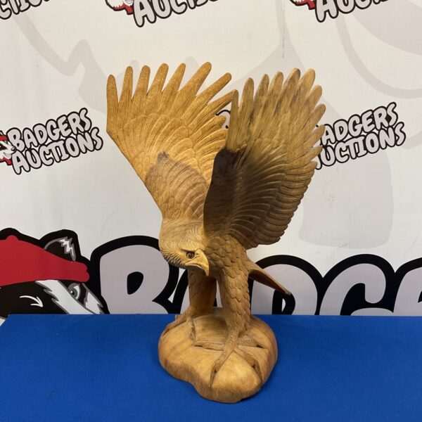 Detailed hand carved wooden eagle sculpture, 40cm tall.