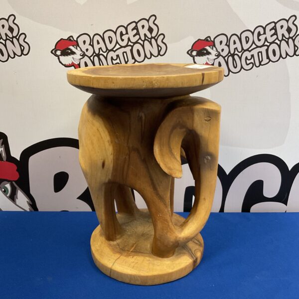 Hand-carved wooden elephant pot stand for plants, unique home decor.