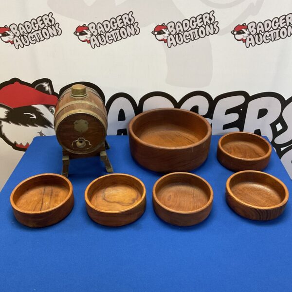 Rustic wooden serving bowls and decorative barrel set.