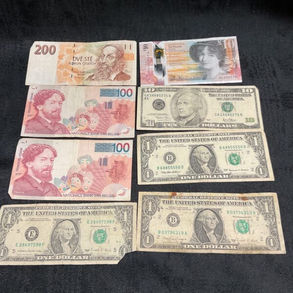 Collection of world banknotes including Scottish, US and Belgian currency.