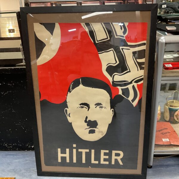 Vintage WWII propaganda poster of Adolf Hitler, historical ephemera.