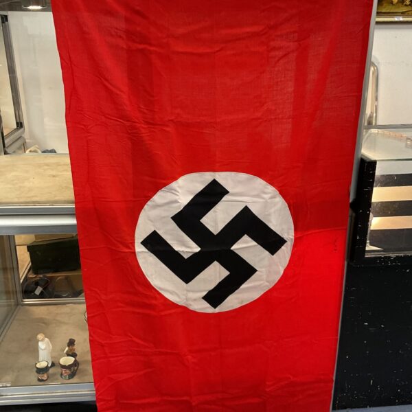 WWII German flag with swastika emblem, historical military memorabilia.