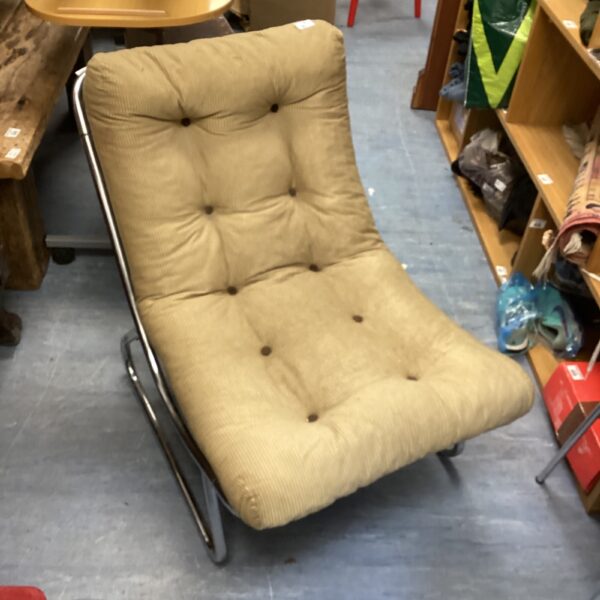 Vintage 1970s sling chair with tubular steel frame.