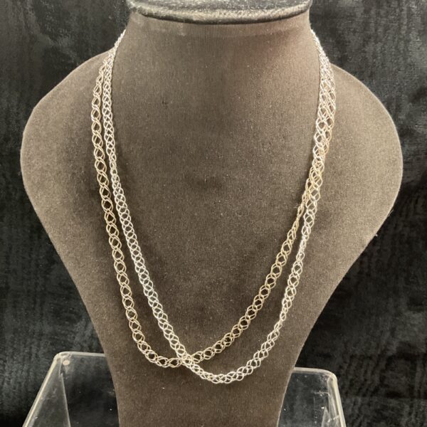 Two 925 silver double link chain necklaces on a display.
