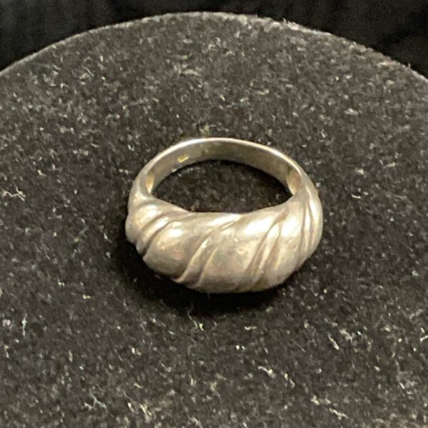 Close-up of a textured 925 silver ring, size M.
