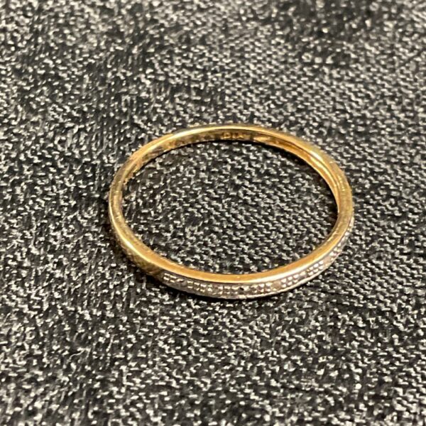 Close-up of a 9ct gold diamond ring, size M.