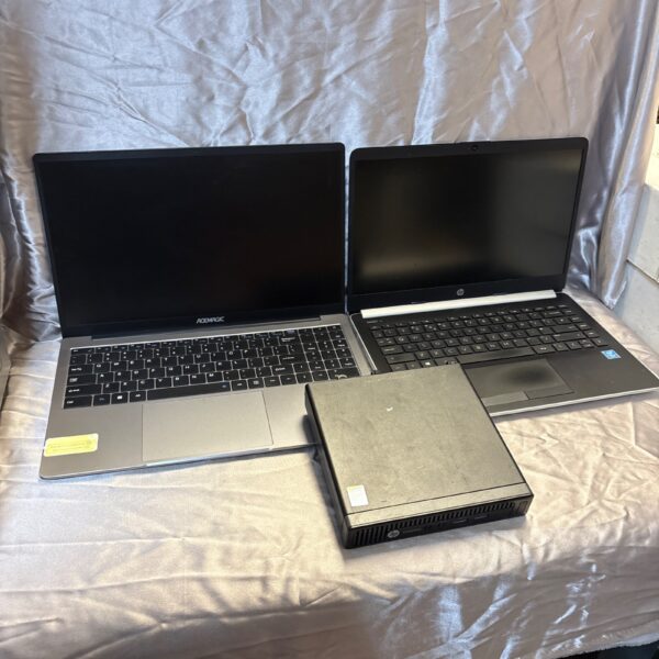 Laptop bundle featuring Acemagic and HP computers for repair or parts.