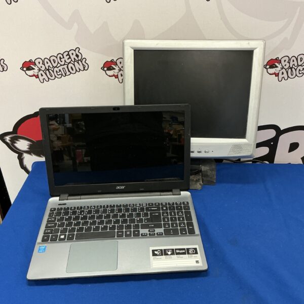 Used Acer laptop with monitor in a computer lot.